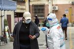 A resident registers for a Covid-19 test in a neighborhood placed under lockdown in Shanghai.