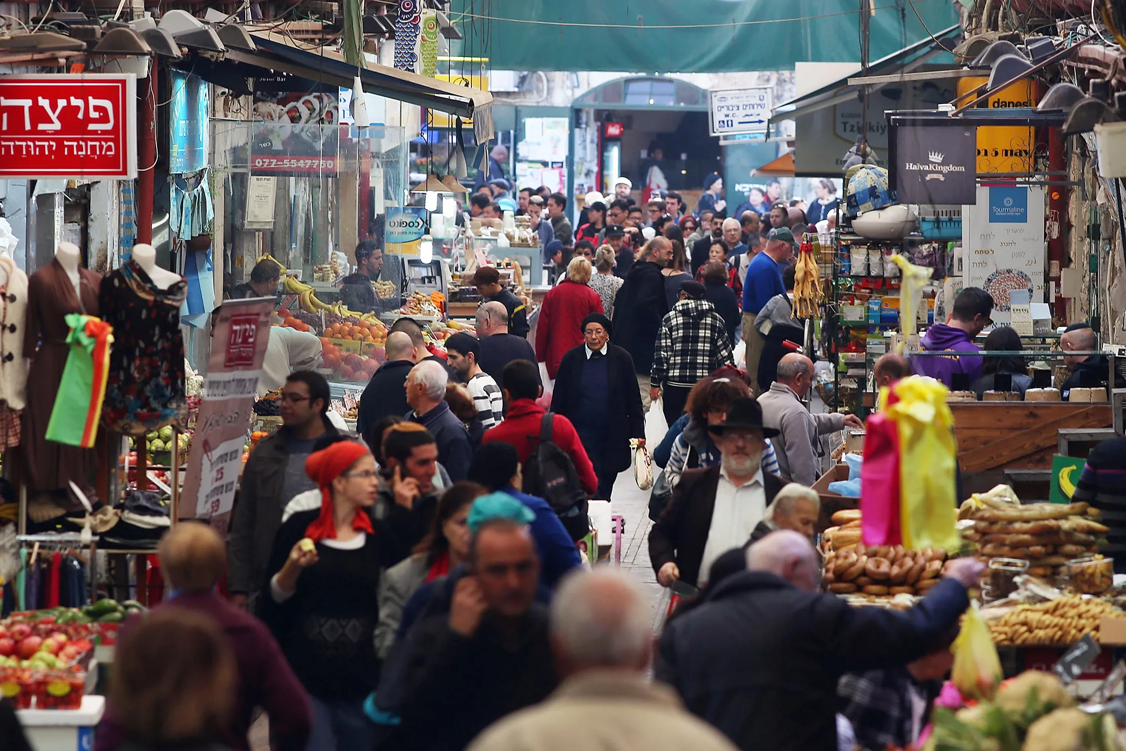People walk through a market&nbsp;in Jerusalem.&nbsp;