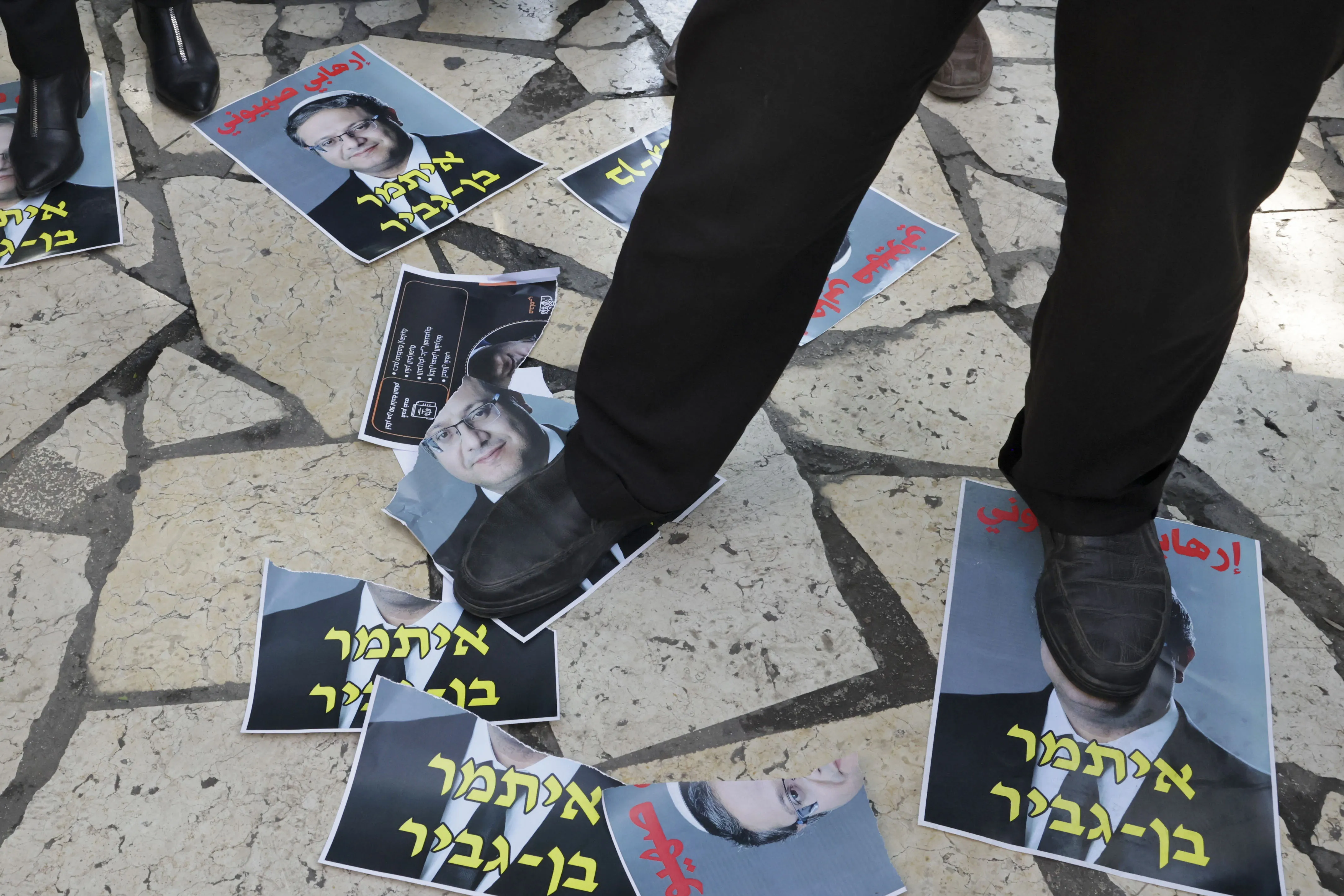 Palestinians step on portraits of&nbsp;Itamar Ben Gvir&nbsp;on November 17 in Hebron, West Bank.