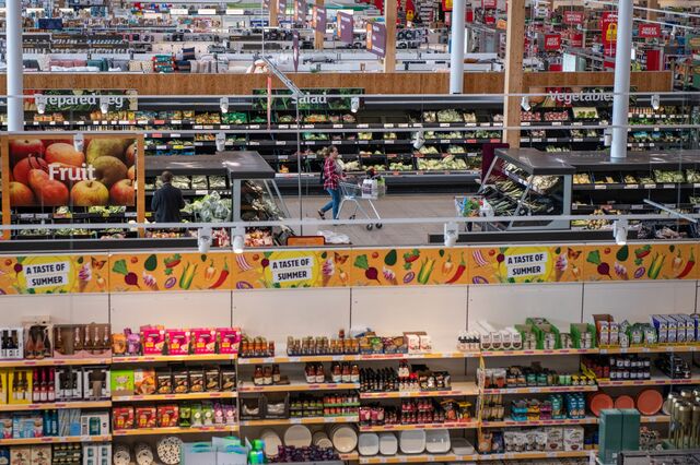A shopper in the fresh produce aisle inside a J Sainsbury Plc supermarket in London, UK, on Tuesday, July 5, 2022. 