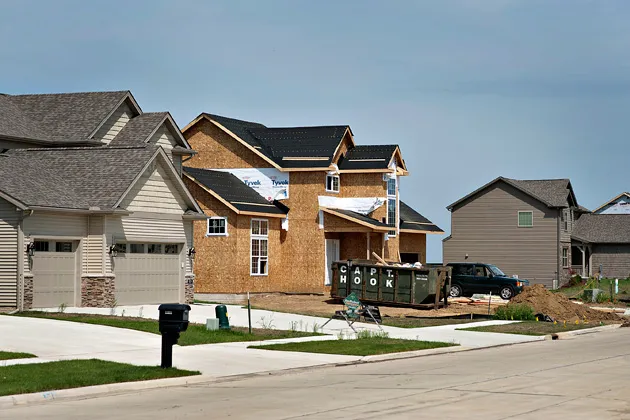 A partially constructed home stands in a housing development in Peoria, Ill.