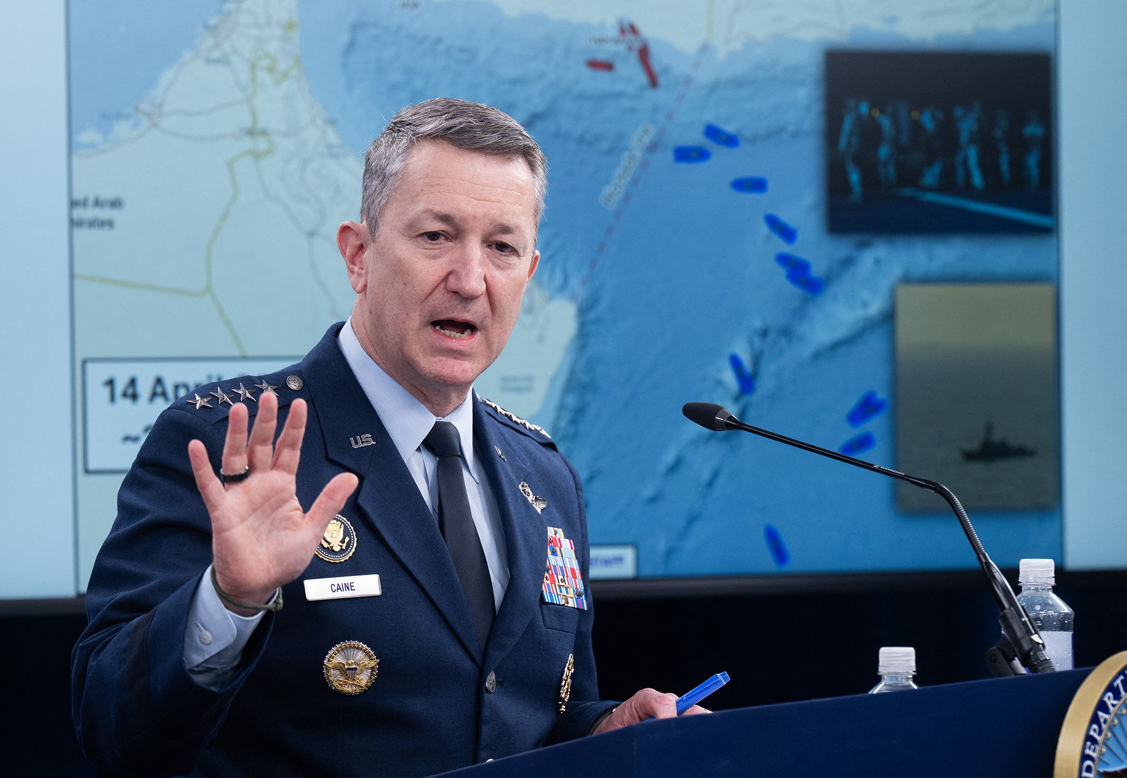 Chairman of the Joint Chiefs of Staff General Dan Caine speaks as a map of the Strait of Hormuz is displayed during a press briefing at the Pentagon in Washington, DC, on April 16.
