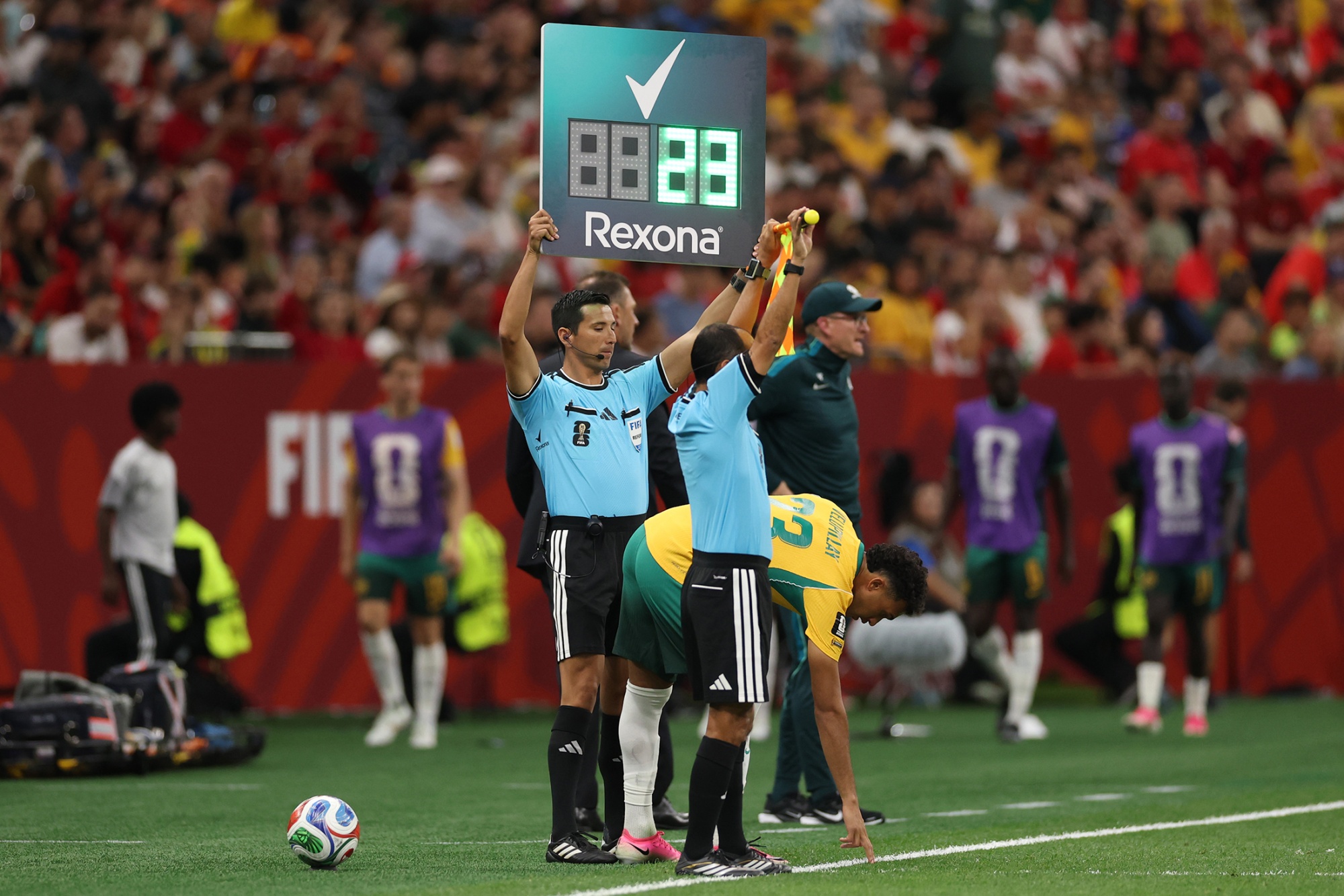 Fourth Official, Kevin Ortega, holds aloft the Rexona substitution board during the FIFA World Cup 2026 Group D match between Australia and Türkiye at BC Place Vancouver on June 13, 2026 in Vancouver, British Columbia. Photographer: Stu Forster/Getty Images