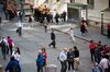 Pedestrians walk along Wall Street near the New York Stock Exchange (NYSE) in New York, U.S., on Friday, May 24, 2019. U.S. equities climbed at the end of a bruising week in which escalating trade tensions dominated markets.