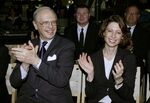 Abigail Johnson and her father Edward (Ned)&nbsp;C. Johnson III applaud as President George W. Bush speaks to company employees about the economy in 2004.