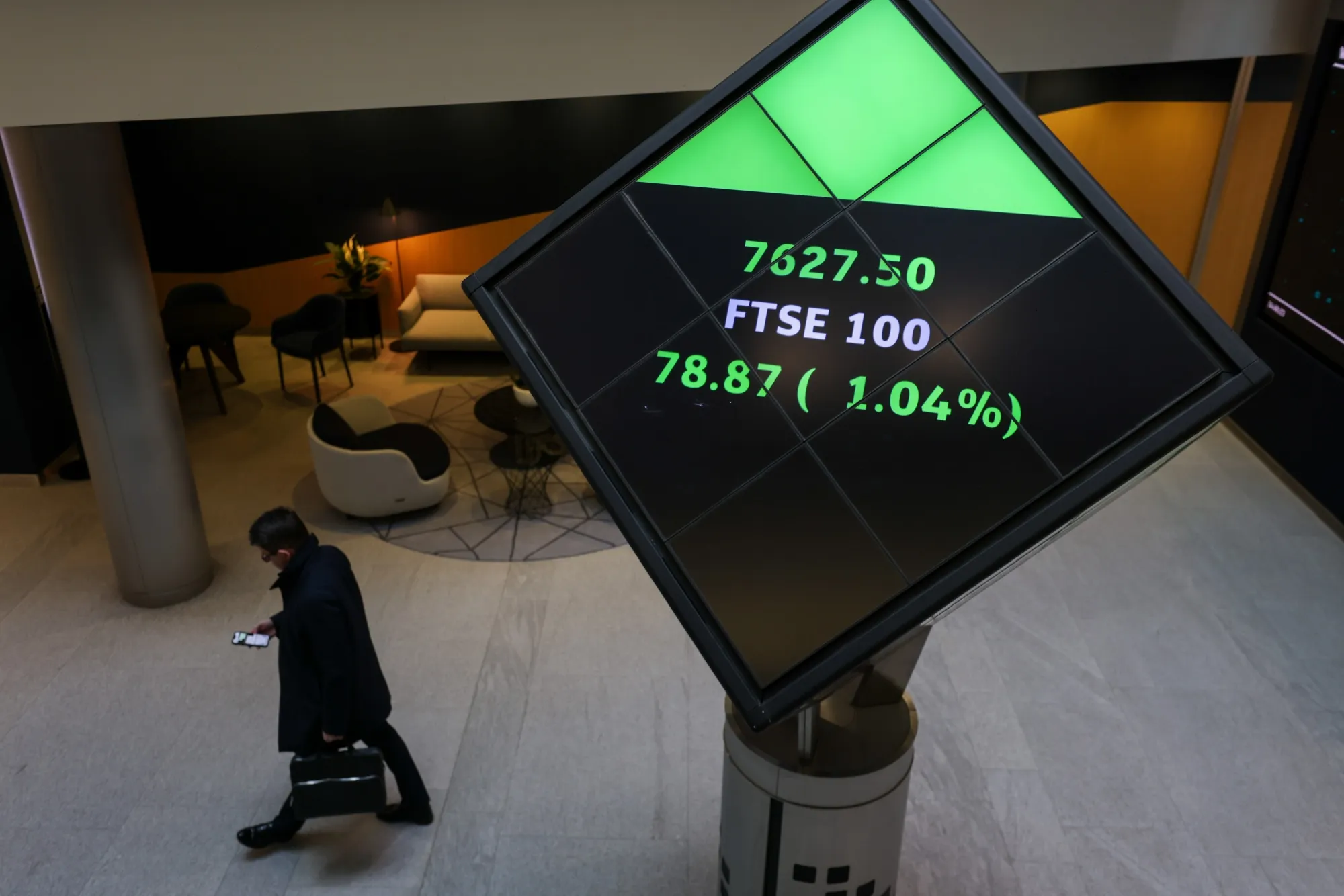 A snapshot of the FTSE 100 in the London Stock Exchange Group Plc office atrium in the City of London, UK, on Tuesday, March 14, 2023.