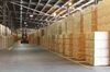 Wrapped packages of paper cellulose sheets sit in a warehouse ahead of distribution at the Ngodwana wood mill, operated by Sappi Ltd., the world's biggest producer of dissolving wood pulp, in Mpumalanga, South Africa, on Wednesday, June 18, 2014. Sappi is increasing its focus on dissolving pulp, used to make luxury clothing, sportswear and pharmaceuticals, as the product carries a higher profit margin than paper.