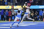 Kansas City Chiefs wide receiver Tyreek Hill, right, grabs a pass in the end zone for a touchdown as Los Angeles Chargers defensive back Tevaughn Campbell defends during the second half of an NFL football game Thursday, Dec. 16, 2021, in Inglewood, Calif. (AP Photo/Marcio Jose Sanchez)