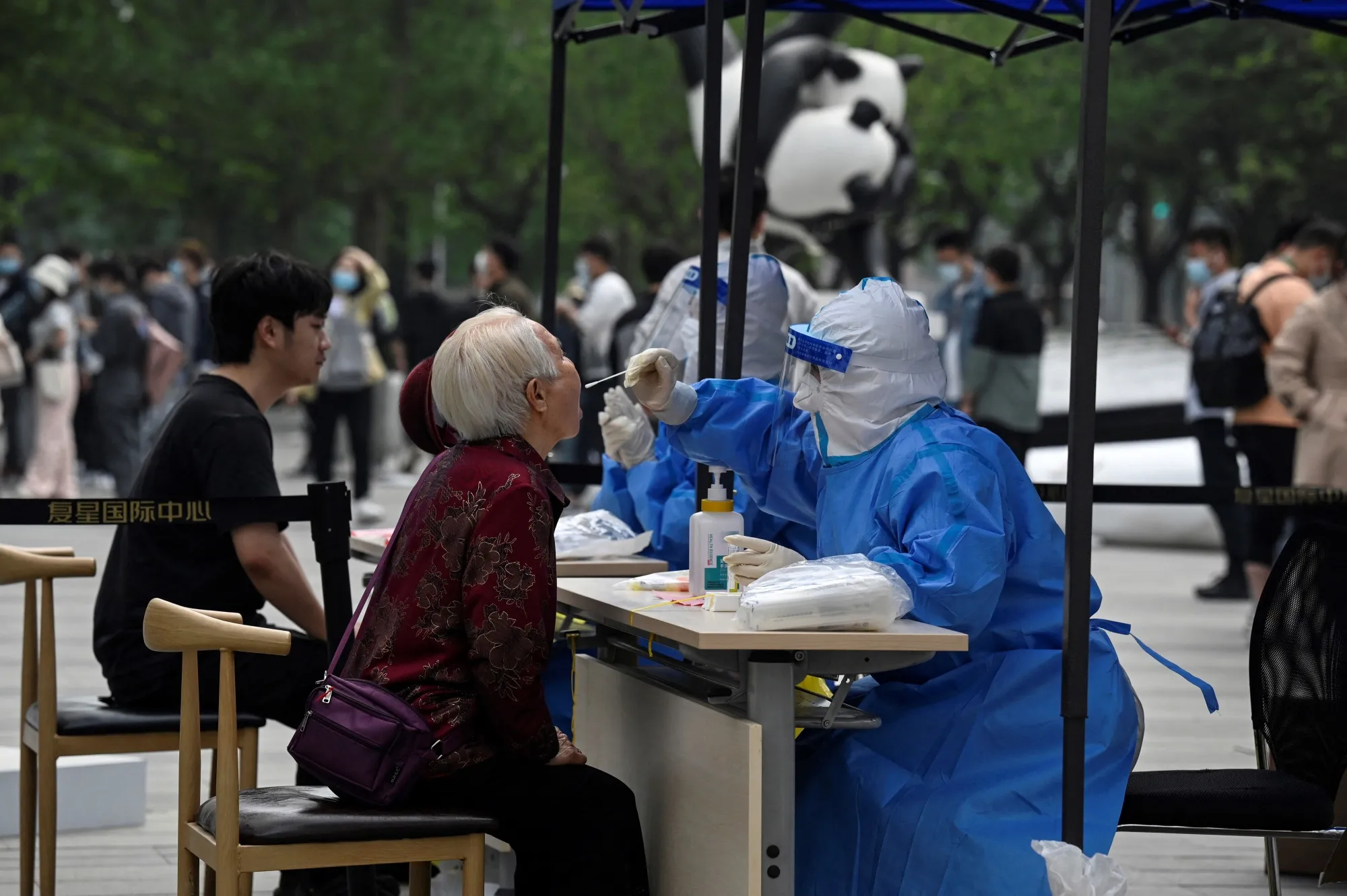 A woman is tested for&nbsp;Covid-19 at a swab collection site in Beijing on April 25.