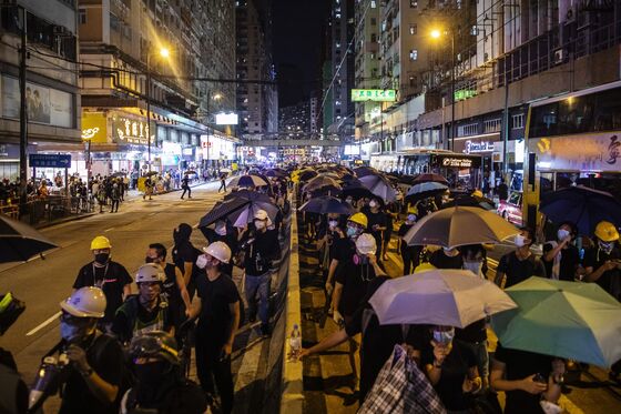 Hong Kong Leader Warns of ‘Ruin’ as Strike Snarls City, Airport
