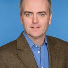 Headshot of Simon P Lonergan