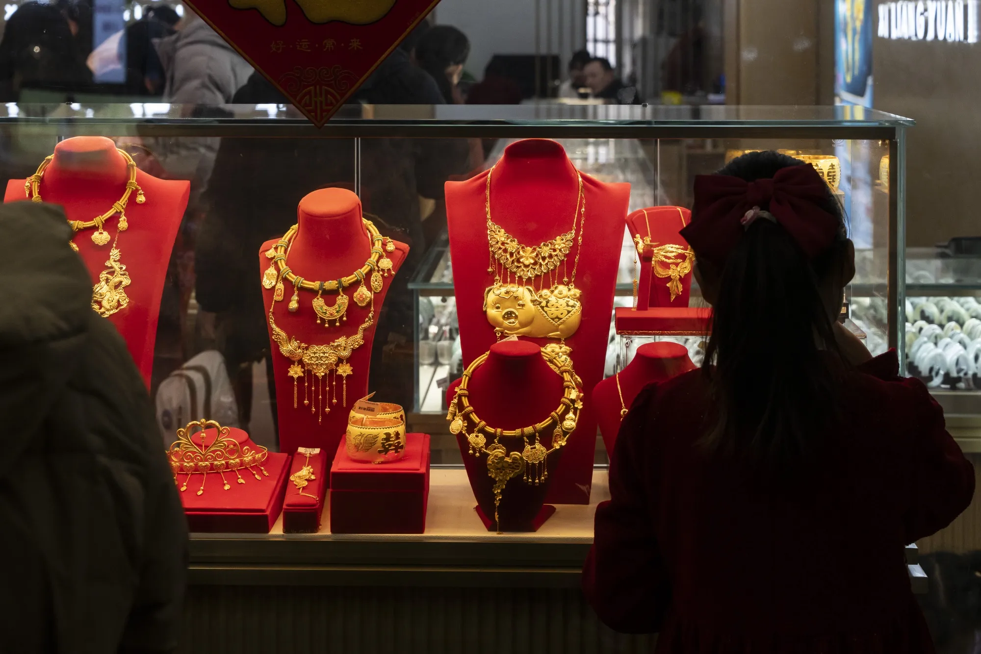 Gold necklaces on display at a jewelry in Shanghai.