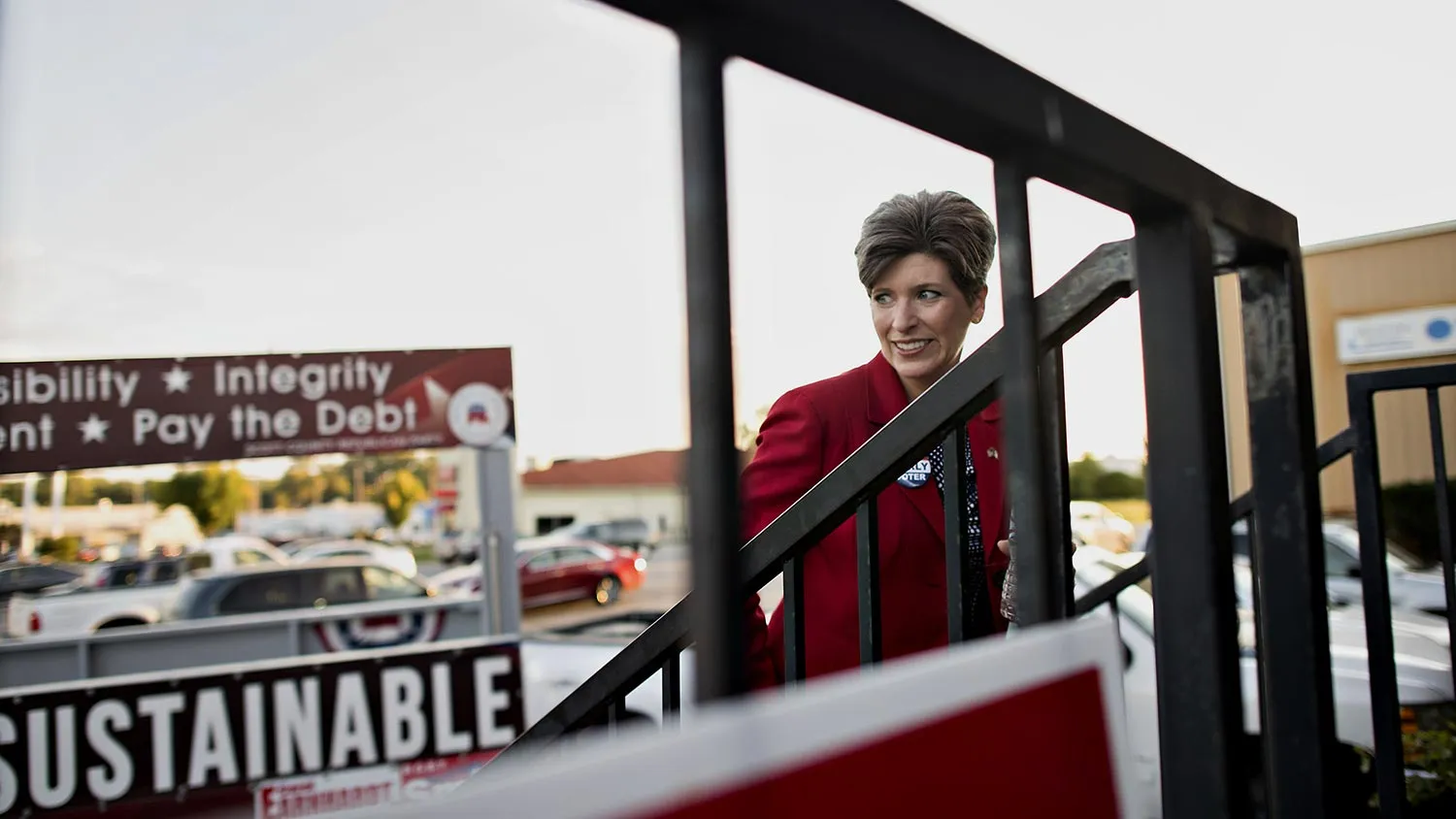 Republican Joni Ernst, running for the U.S. Senate in Iowa, walks outside the Scott County GOP headquarters during a campaign stop in Davenport, Iowa, U.S., on Thursday, Sept. 25, 2014. In Iowa, where a woman never has been elected to the U.S. Senate or governor, Republicans think their female candidate, Ernst, will enable them to reduce the gender gap.
