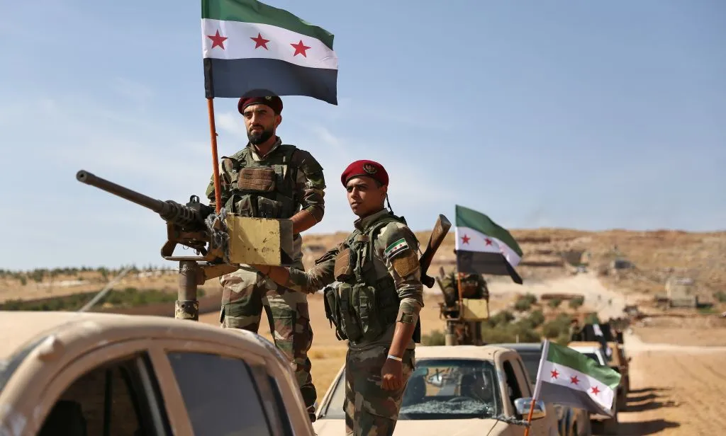 Turkish-backed Syrian rebel fighters on the move.
