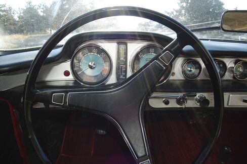 The car came with round dials on the dash and a three-spoke steering wheel.