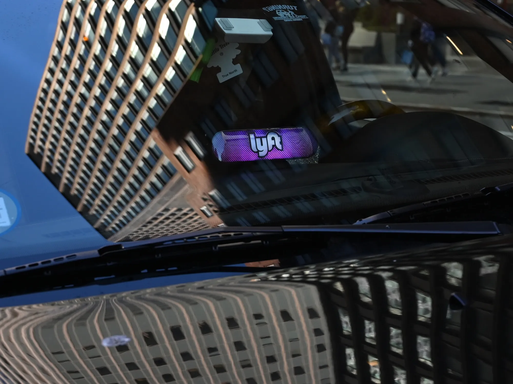 A Lyft ride-sharing car is seen on 42nd Street in New York.