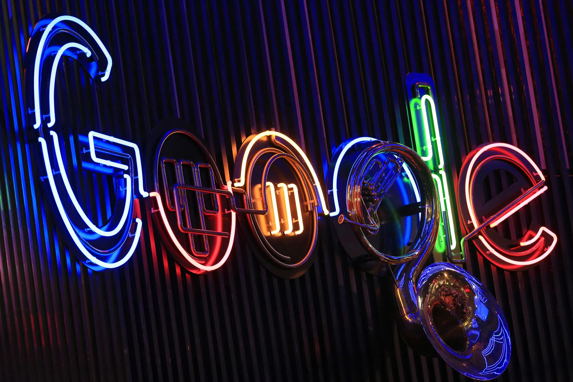 The Google Inc. logo hangs illuminated at the company's exhibition stand at the Dmexco digital marketing conference in Cologne, Germany, on Wednesday, Sept. 14, 2016. Dmexco is a two-day global business and digital economy innovation platform, attracting the industry's most important personalities and corporate decision-makers.

