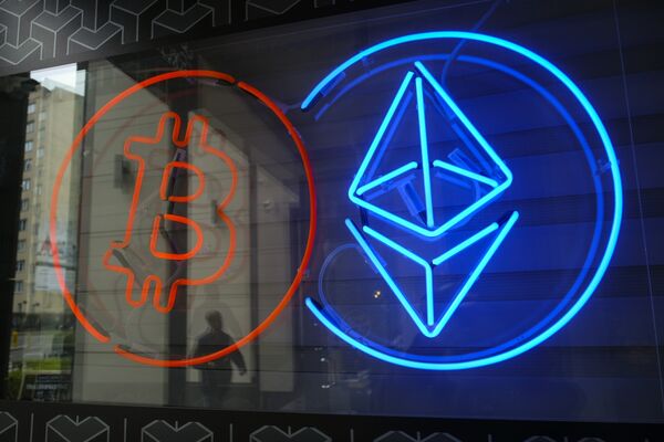 The neon logos of Bitcoin and Ethereum cryptocurrencies.