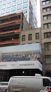 A view of 36 East 57th Street poking out from behind scaffolding in February 2015.