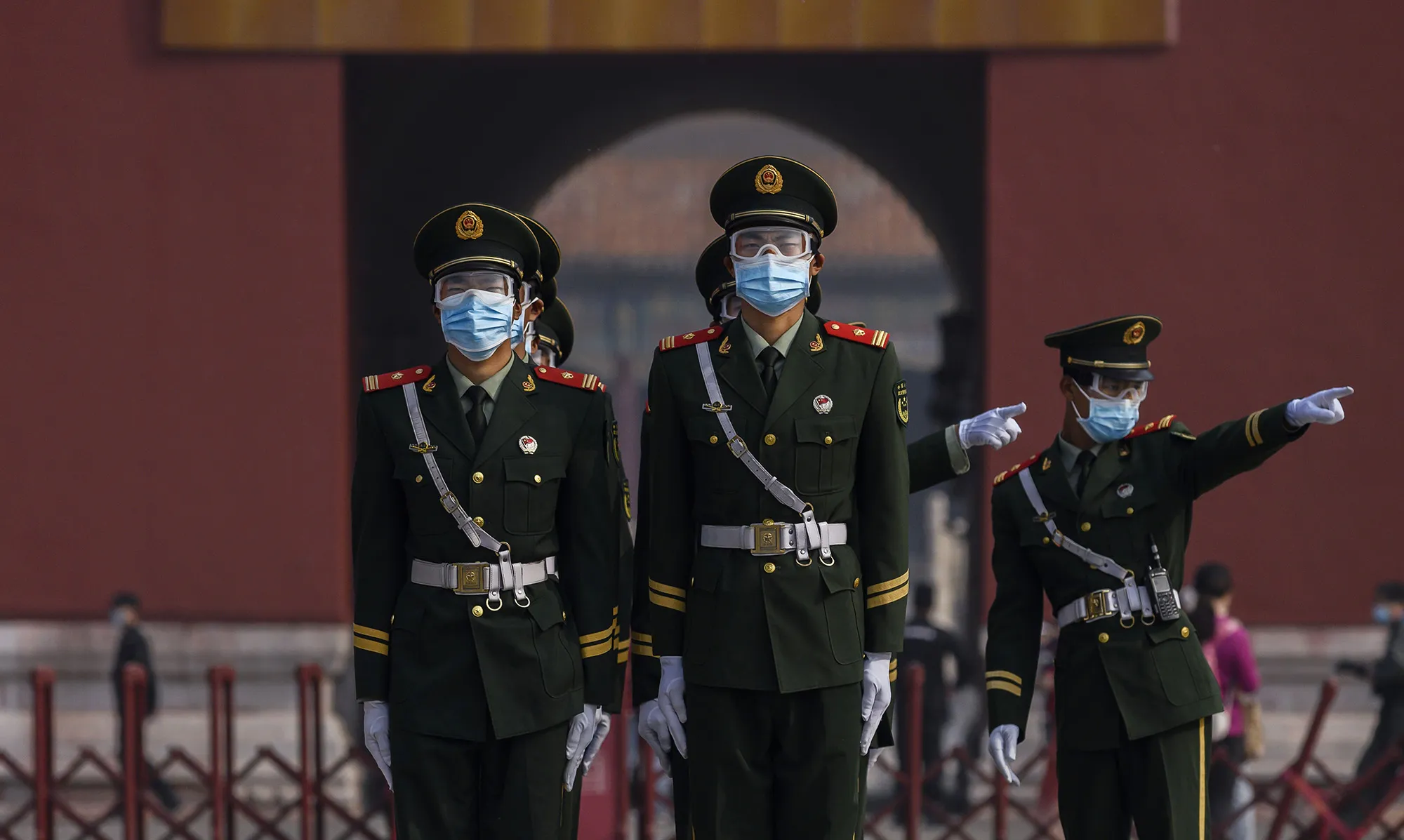 Chinese paramilitary police guard the entrance to the Forbidden City as it re-opened to limited visitors in Beijing on May 1.