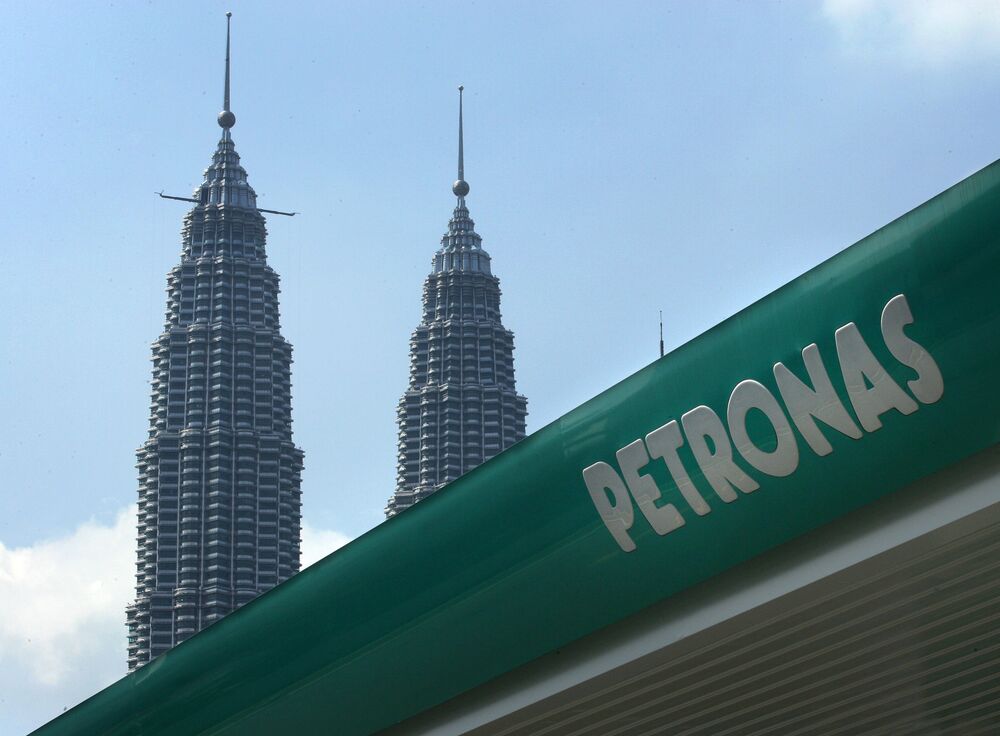 A sign for a Petronas&nbsp;gas station is shown near the Petronas Towers in Kuala Lumpur, Malaysia.