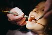 Little Girl Having Her Teeth Checked During a Dentist Visit