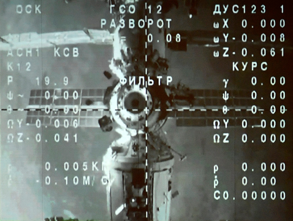 The International Space Station (ISS) is seen on a monitor.