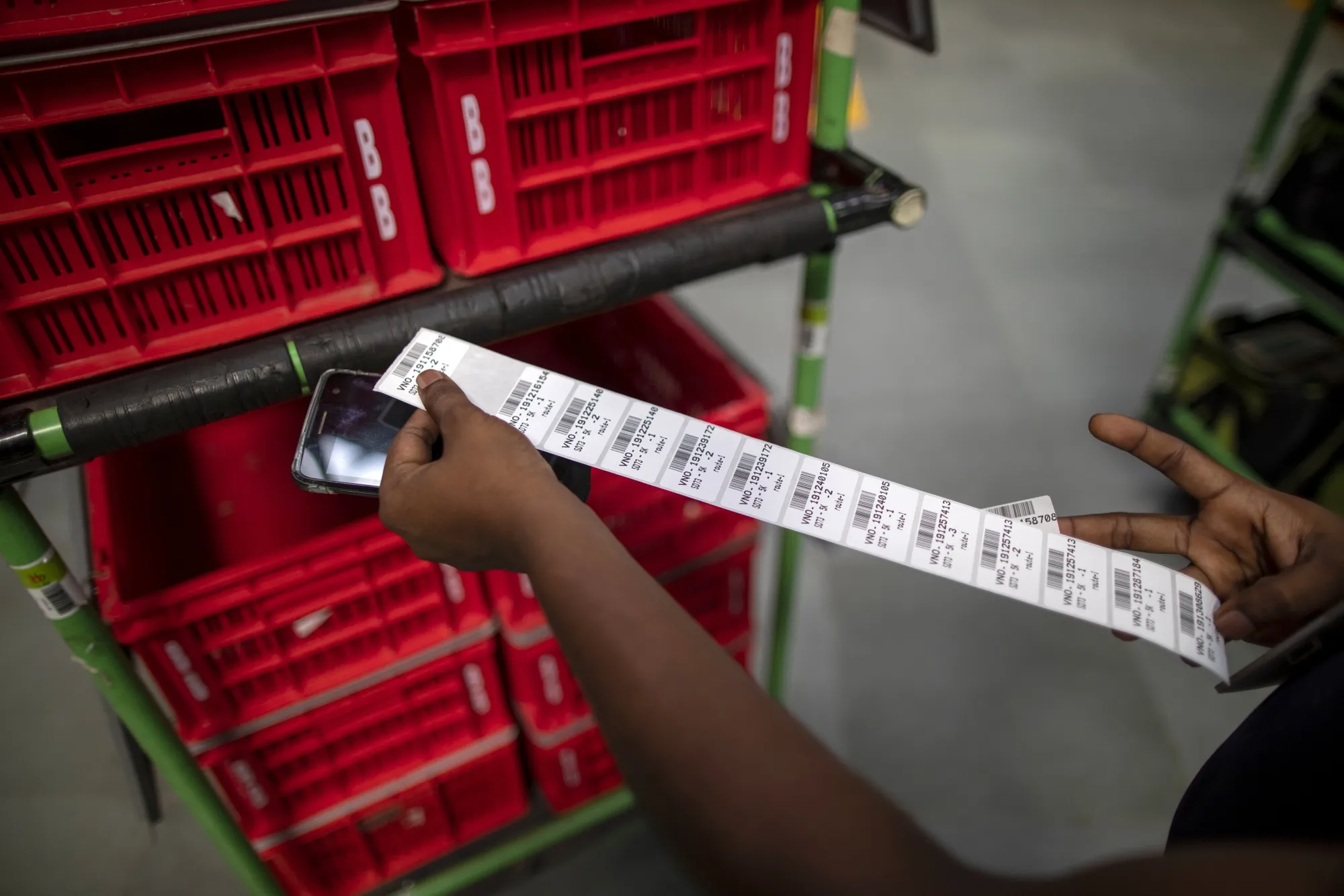 A worker checks orders at a BigBasket warehouse in Noida, Uttar Pradesh, India.