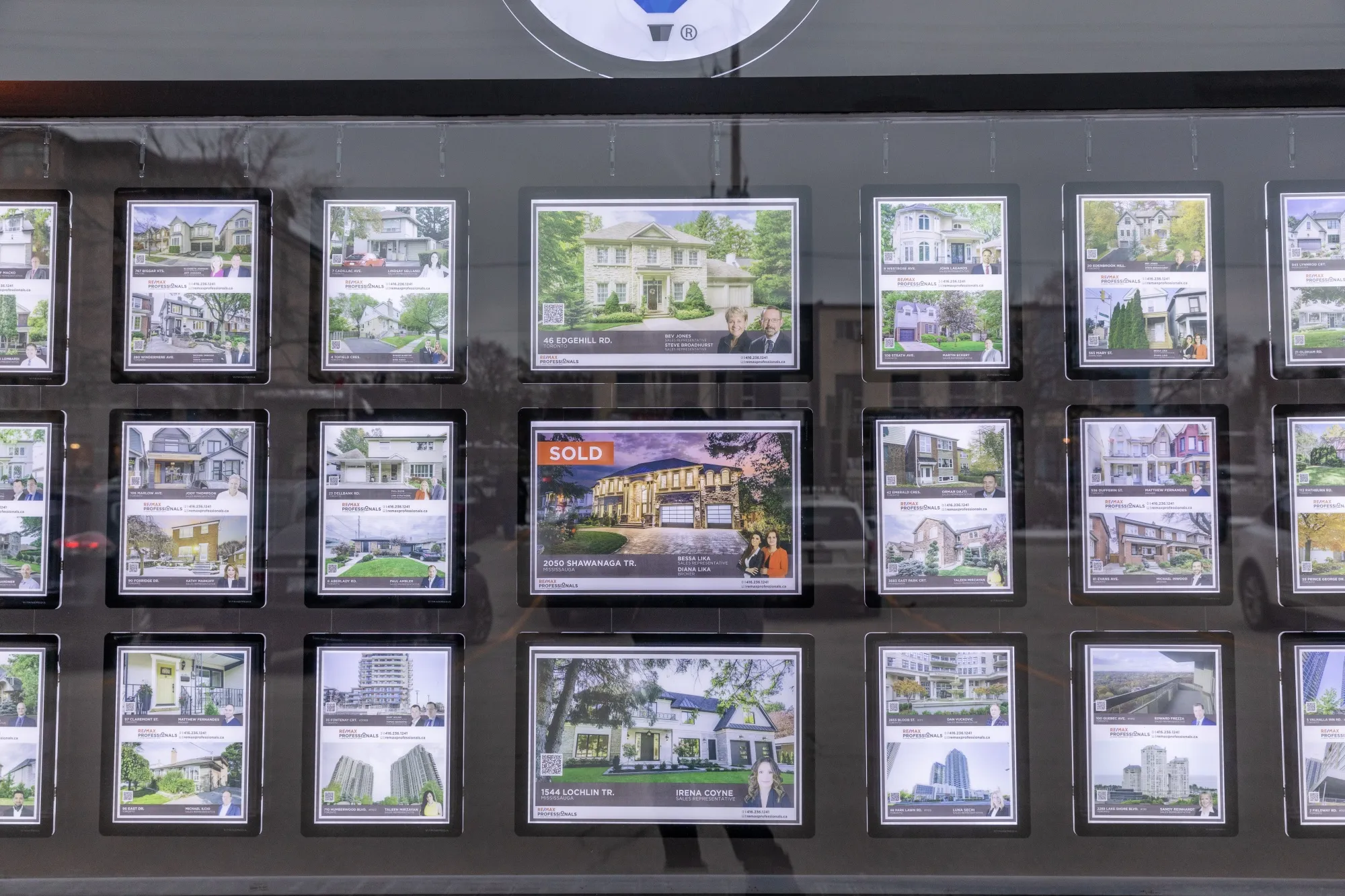 Real estate listing are displayed in a window at a Remax Choice Properties office in Toronto, Ontario, Canada, on Saturday, Feb. 15, 2020. A shrinking supply of available homes for sale in Canada's largest city continued to drive prices higher last month, bringing annual increases to the strongest in more than two years.