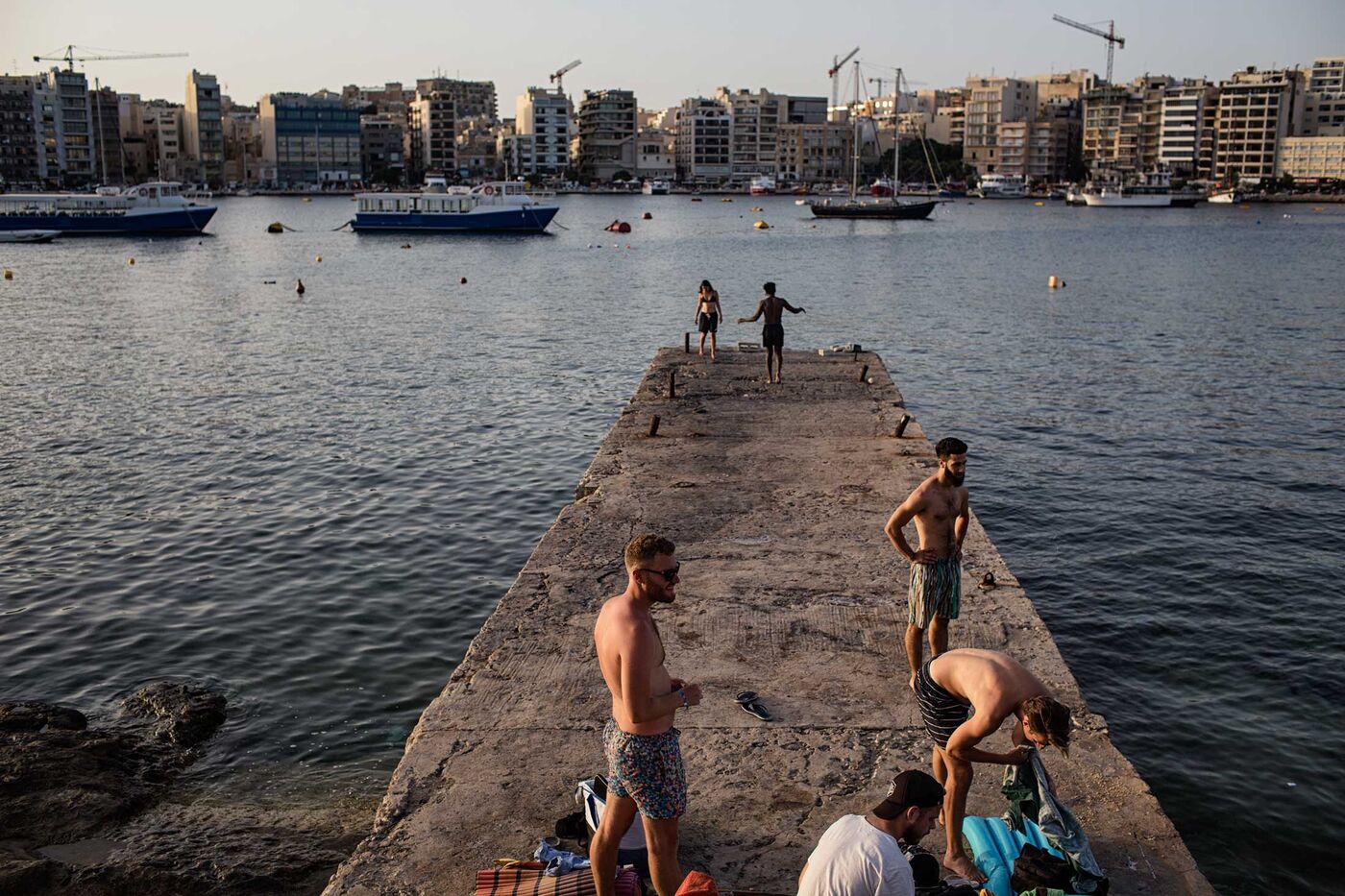 Taking a sunset dip in Sliema Harbor, near Manoel Island.