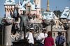 Disneyland security guards conduct a morning meeting prior to the park's opening at Walt Disney Co.'s Disneyland Park, part of the Disneyland Resort, in Anaheim, California, U.S., on Wednesday, Nov. 6, 2013.