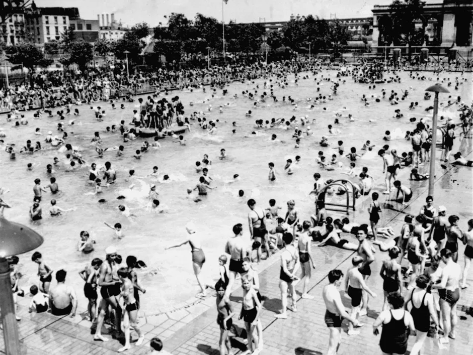 City children at a pool at 112th Street and First Avenue in East Harlem, New York, 1938.