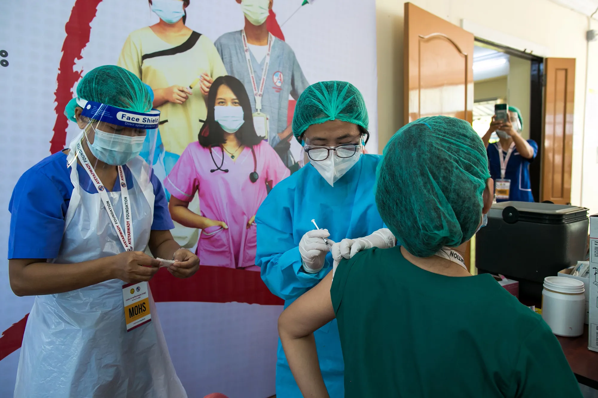 A health worker receives a Covid-19 vaccine&nbsp;in Yangon on Jan. 27.