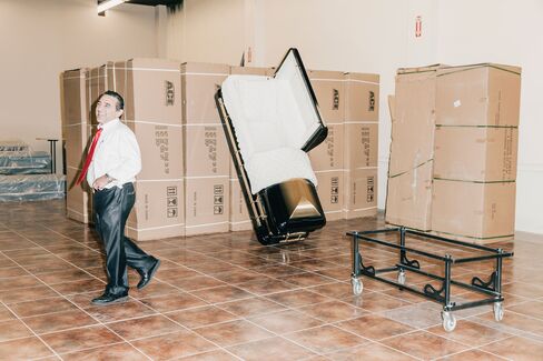 Malamas at a client’s storage facility in Gardena, Calif. If he finds a minor defect in a casket, he’ll often gift it to a needy widow.
