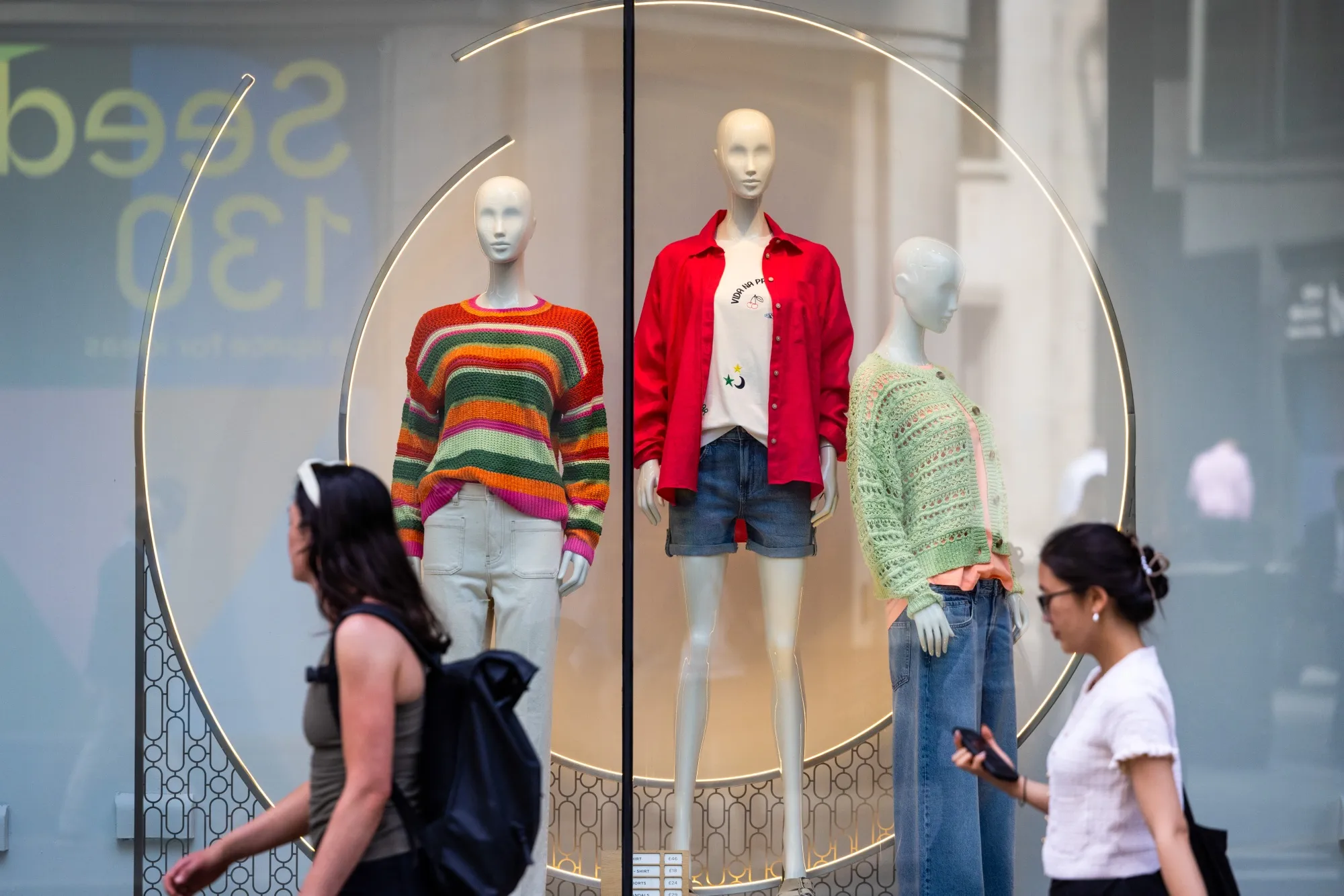 Mannequins in the window of a Next Plc store in London, UK.