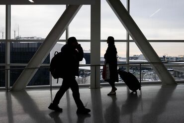 Travelers At JFK Airport Ahead Of Christmas Holiday