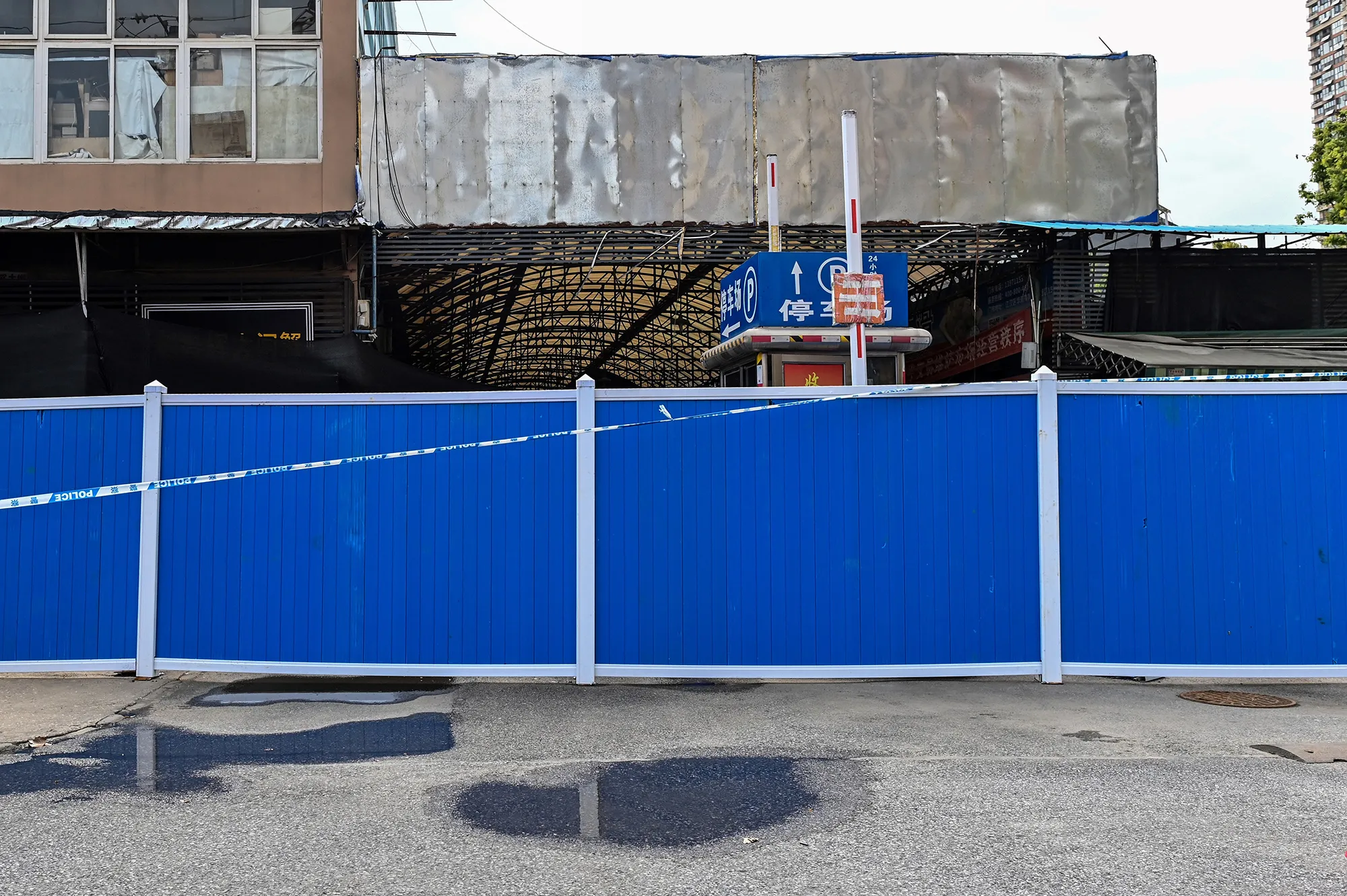 A barricade stands outside the closed Huanan Seafood Wholesale Market in Wuhan on April 1.