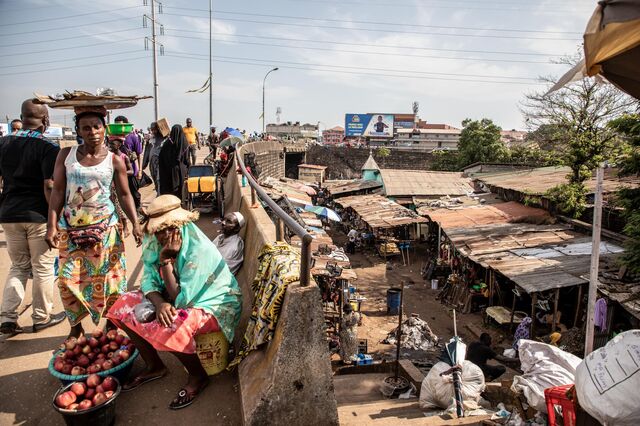 Street vendors in Conakry, the capital of Guinea. Despite abundant mineral resources, 44% of the nation’s 13 million people live in poverty.