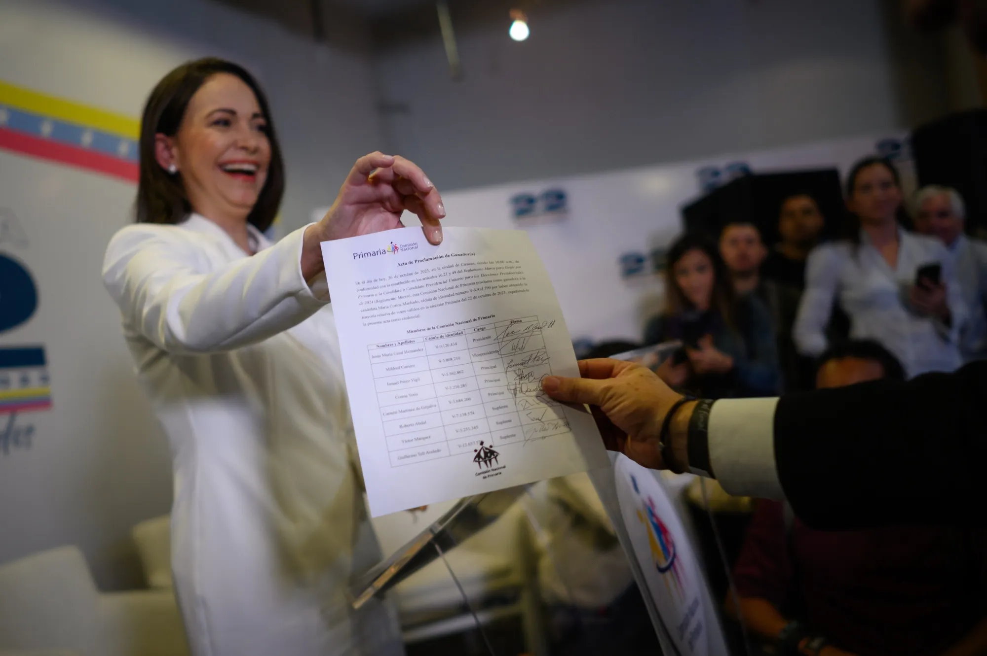 María Corina Machado displays a document proclaiming her victory in Venezuela’s opposition primaries during a ceremony in Caracas on Oct. 26.