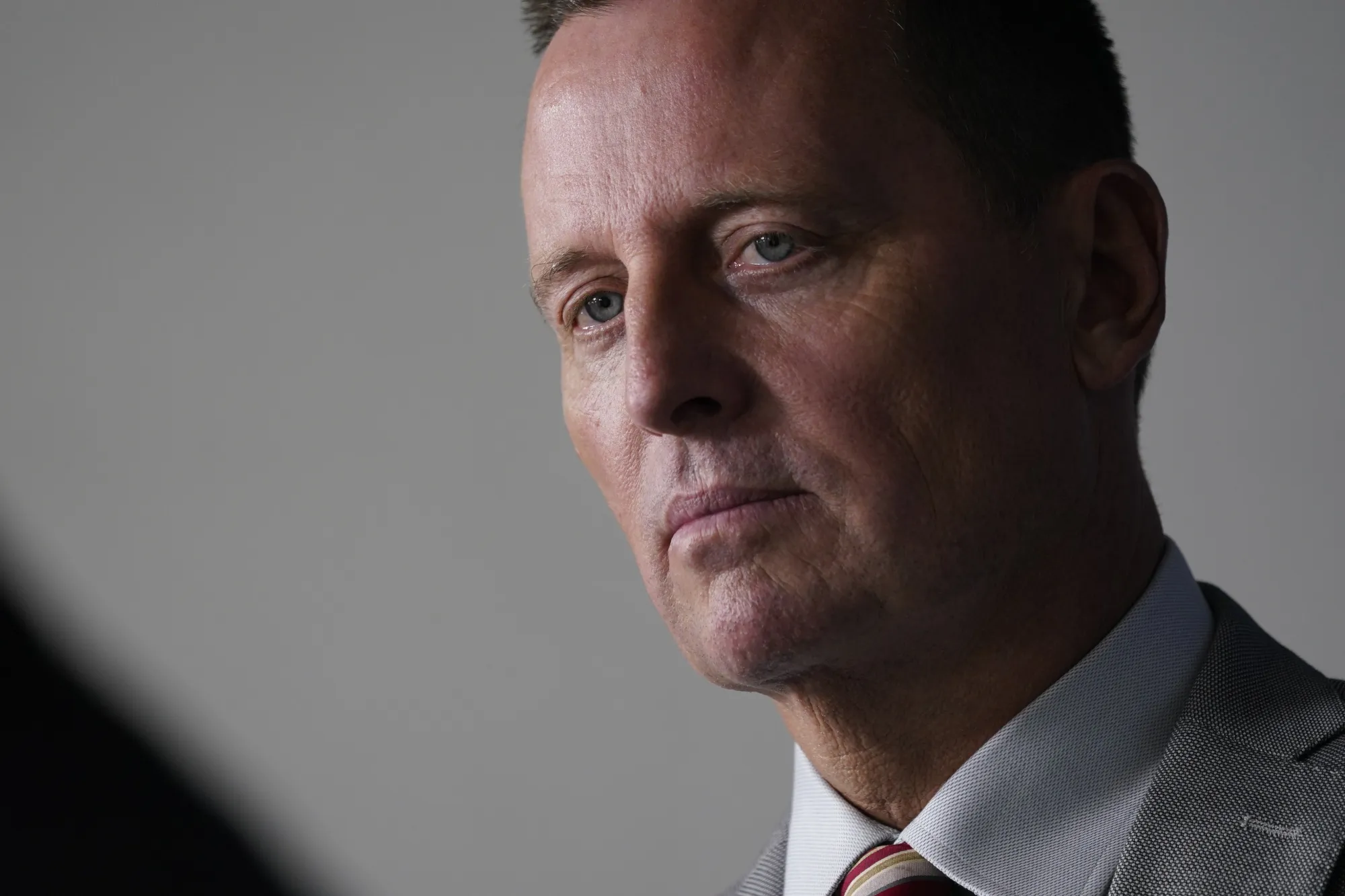 Richard Grenell listens during a news conference in the James S. Brady Press Briefing Room at the White House in Washington, D.C., U.S., on Friday, Sept. 4, 2020.&nbsp;