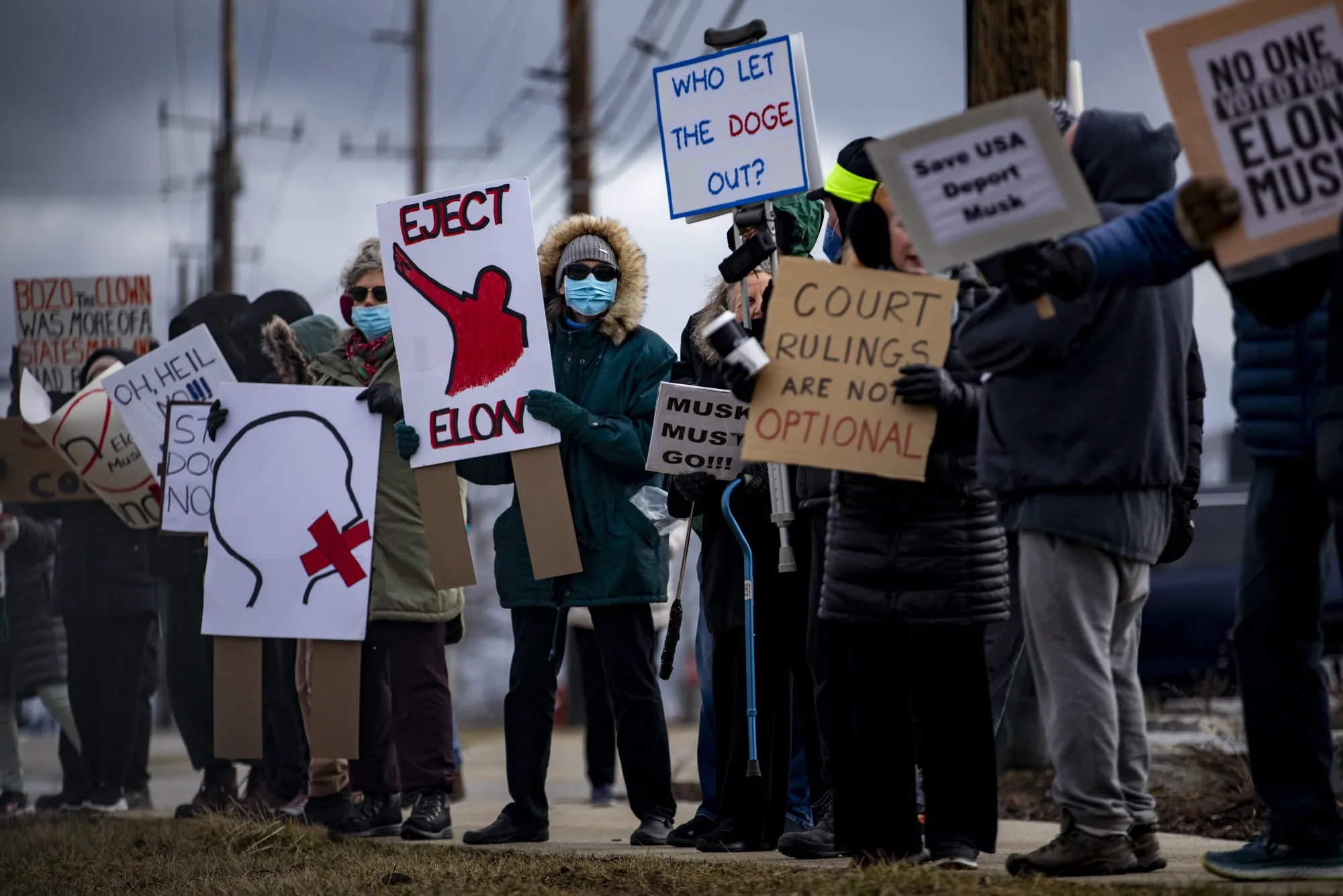Protesters outside a Tesla showroom in West Bloomfield, Michigan, on March 20.