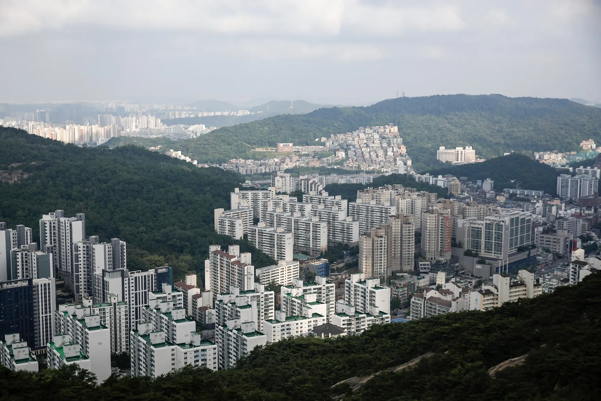 The Bank of Korea held its benchmark rate at a restrictive 3.5% last month and cautioned that its signal of an interest rate cut could further fuel a rally in real estate markets and add to household debt.