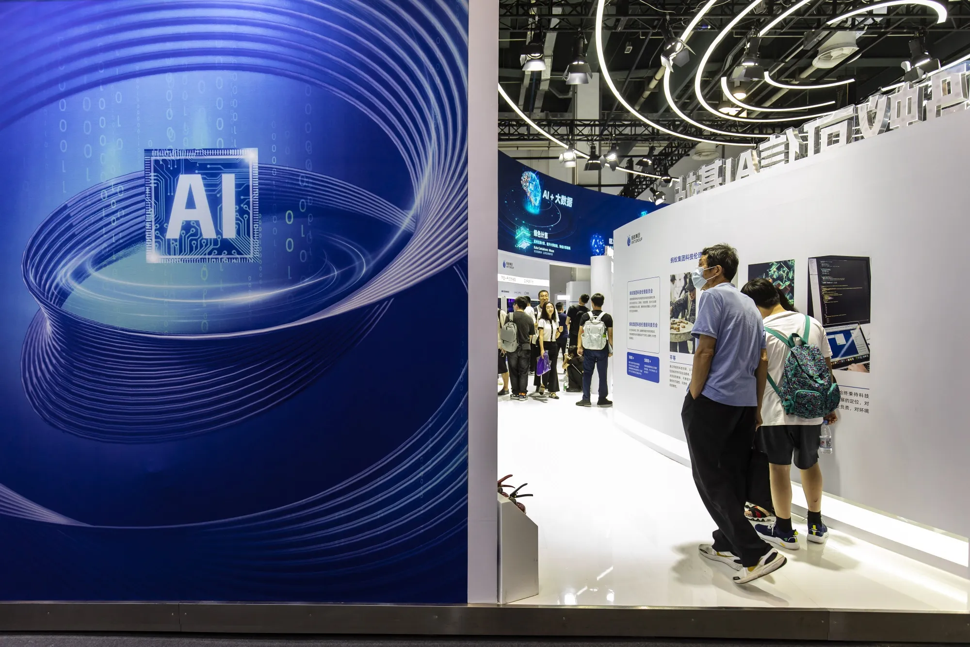 Attendees at the Ant Group booth at the World Artificial Intelligence Conference&nbsp;in Shanghai in July.