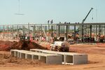 Workers construct the frame of a data center building during a media tour of the Stargate AI data center in Abilene, Texas, US, on Tuesday, Sept. 23, 2025. Stargate is a collaboration of OpenAI, Oracle and SoftBank, with promotional support from President Donald Trump, to build data centers and other infrastructure for artificial intelligence throughout the US.