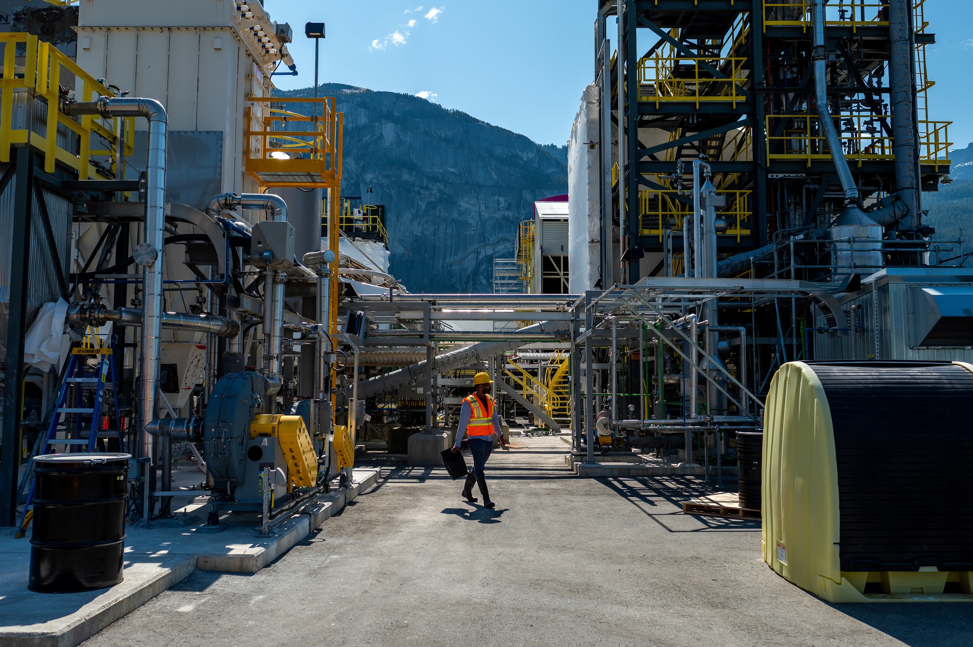 A worker walks through the Carbon Engineering Innovation Centre, a direct air capture research and development&nbsp;facility, in Squamish, British Columbia, Canada. Companies trying to pull carbon from the air are increasingly&nbsp;being asked to prove what they do and rely on a process known as monitoring, verification and reporting or MRV.