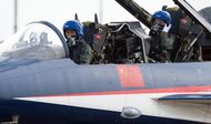 A female pilot sits in a J-10 fighter jet of the Bayi Aerobatic Team of PLA's (Peoples Liberation Army) Air Force before taking off at the Airshow China 2014 in Zhuhai, south China's Guangdong province on November 11, 2014. Global aviation firms flocked to China on November 11 to show off their wares as economic development and an expanding middle class promise a bonanza in one of the world's fastest-growing aircraft markets.  The 10th Airshow China 2014 takes place from November 11 to 16.   AFP PHOTO / JOHANNES EISELE        (Photo credit should read JOHANNES EISELE/AFP/Getty Images)