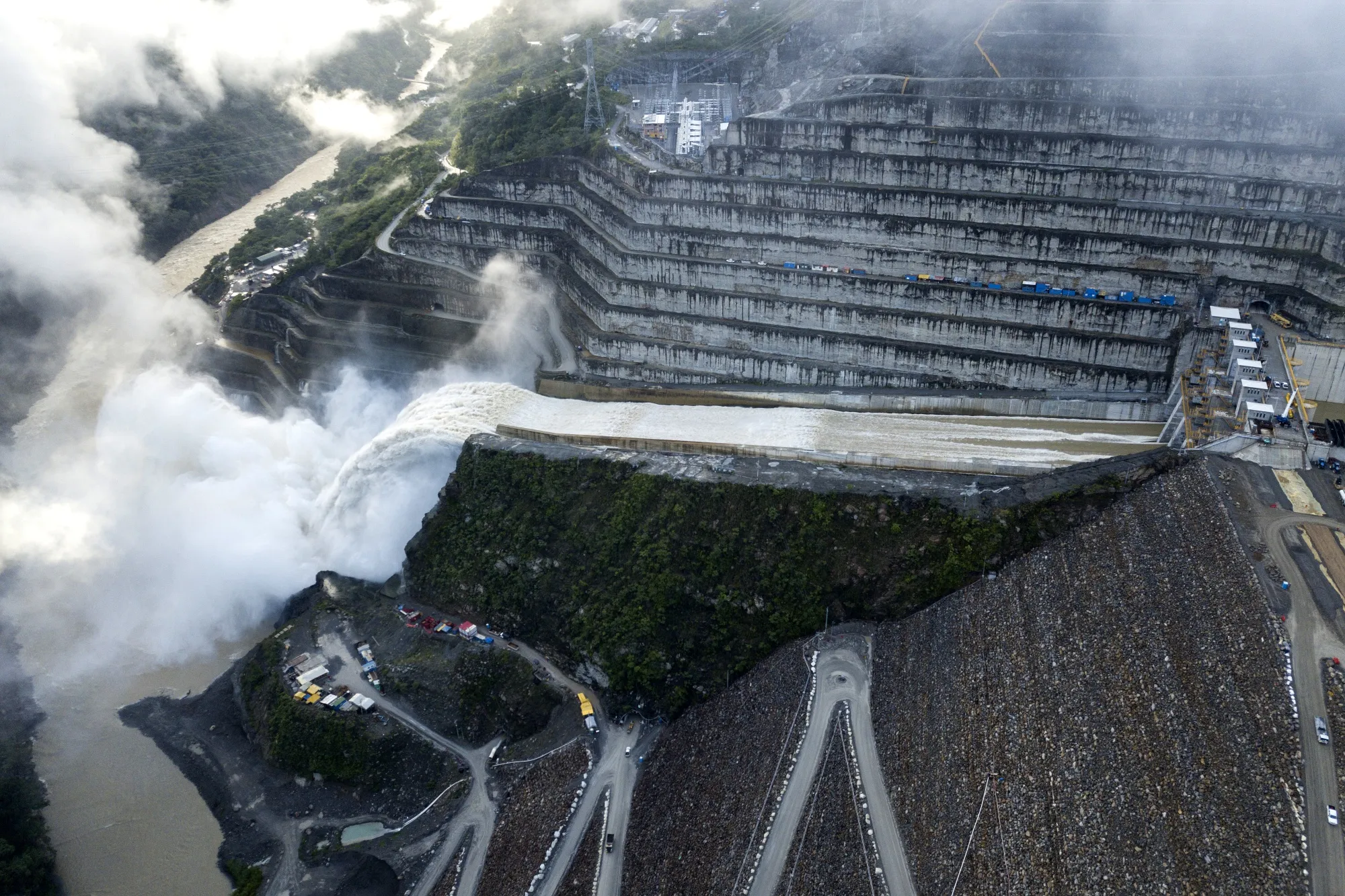 Water flows down the Hidroituango hydroelectric dam wall in these aerial photographs taken above Ituango, Colombia, on Saturday, June 8, 2019.