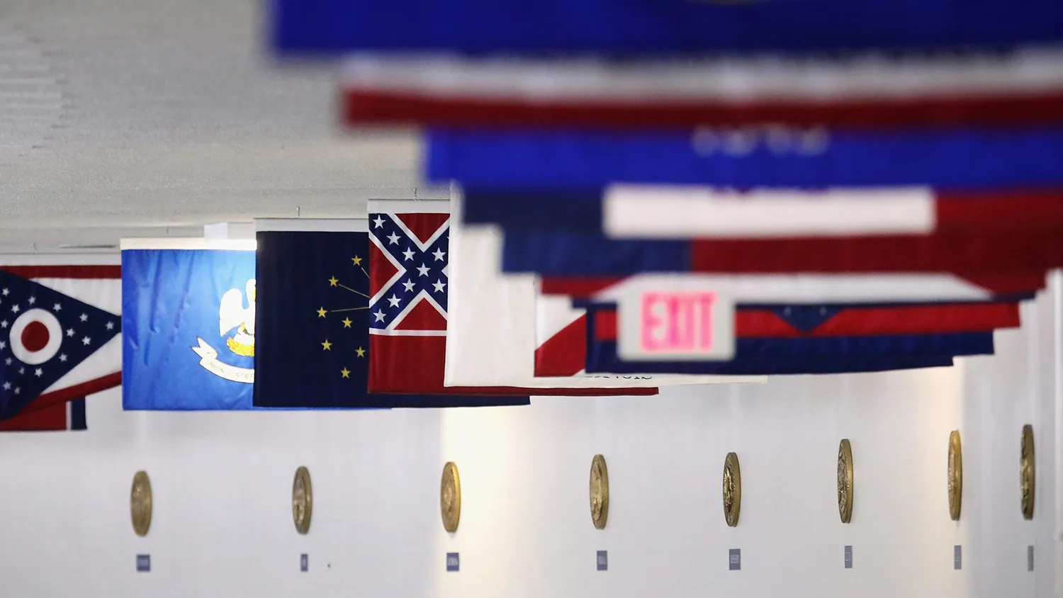 The state flag of Mississippi, which incorporates the flag of the Confederate States of America in the top left corner, is displayed with the flags of the other 49 states and territories in the tunnel connecting the senate office building and the U.S. Capitol June 23, 2015 in Washington, DC.
