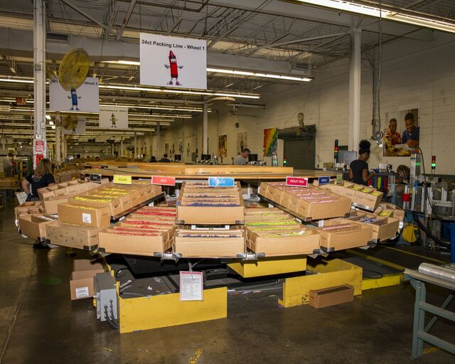 After drying, crayons sit in magazines, waiting to be sorted.