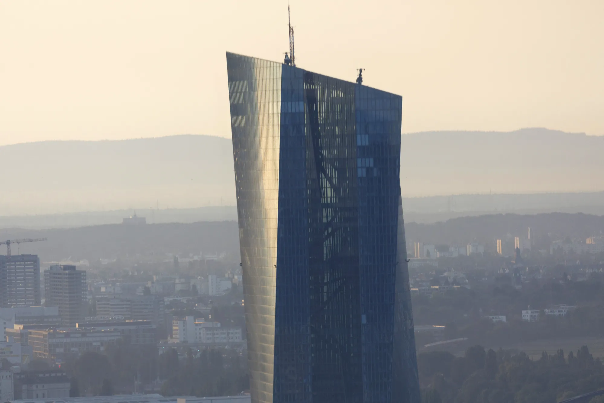 The European Central Bank headquarters building stands at dawn in Frankfurt, Germany.